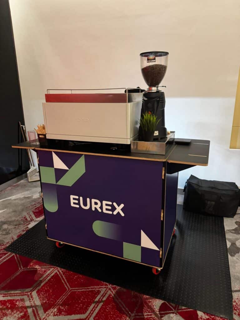 Purple Eurex branded coffee bar by Tom’s Coffee at the FIA IDX exhibition