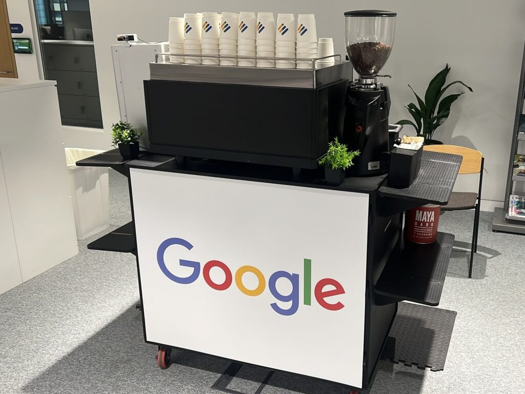 Google-branded mobile coffee bar by Tom’s Coffee with espresso machine, grinder and branded cups