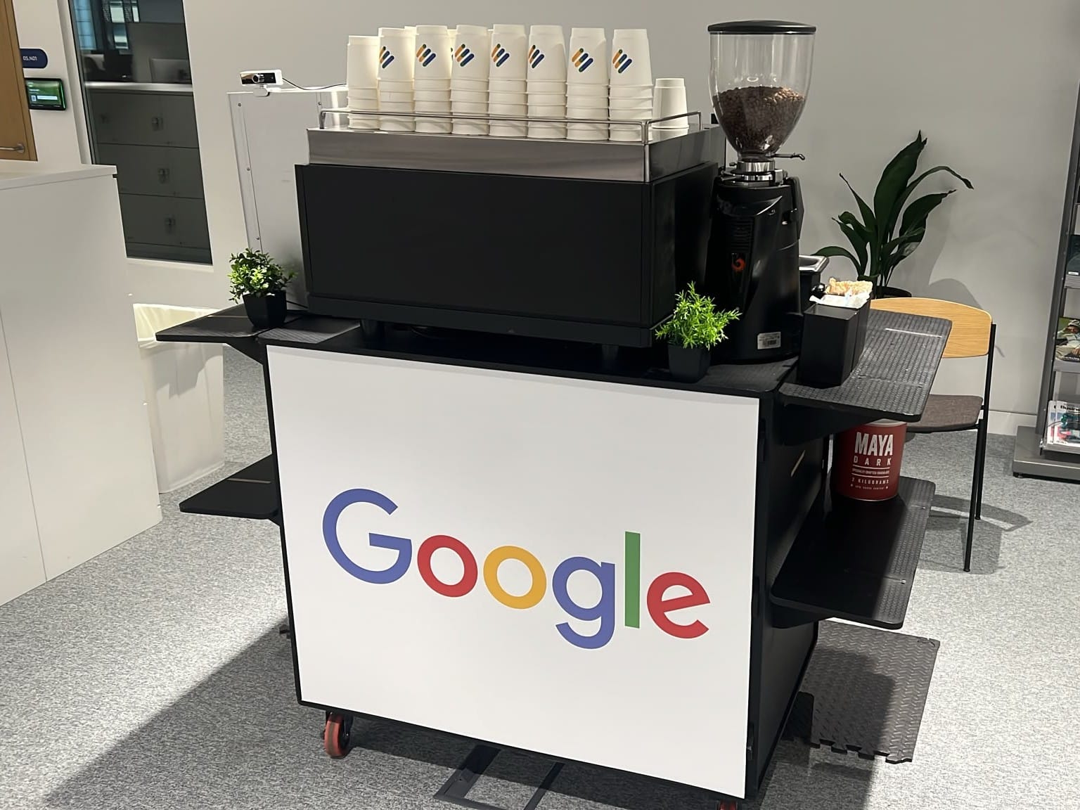 Google-branded mobile coffee bar by Tom’s Coffee with espresso machine, grinder and branded cups